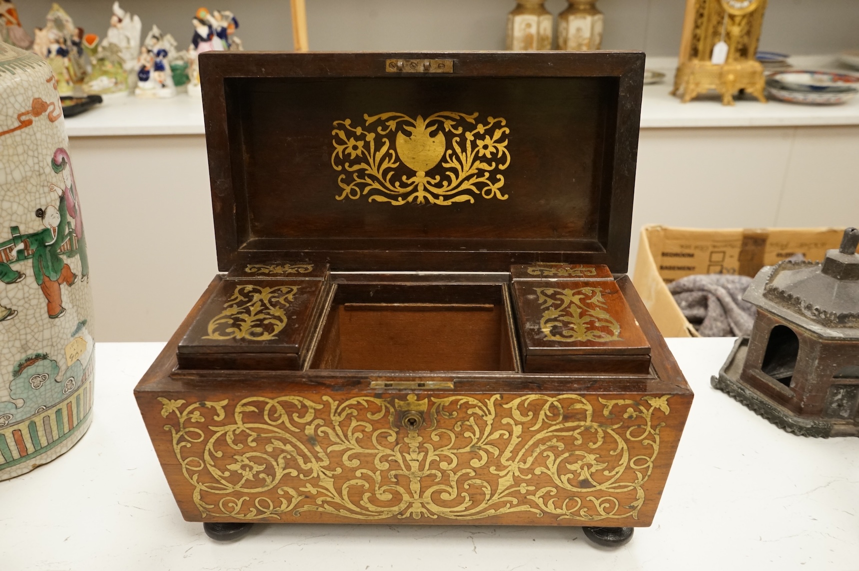 A William IV rosewood and cut brass inlaid tea caddy, 32cm wide
